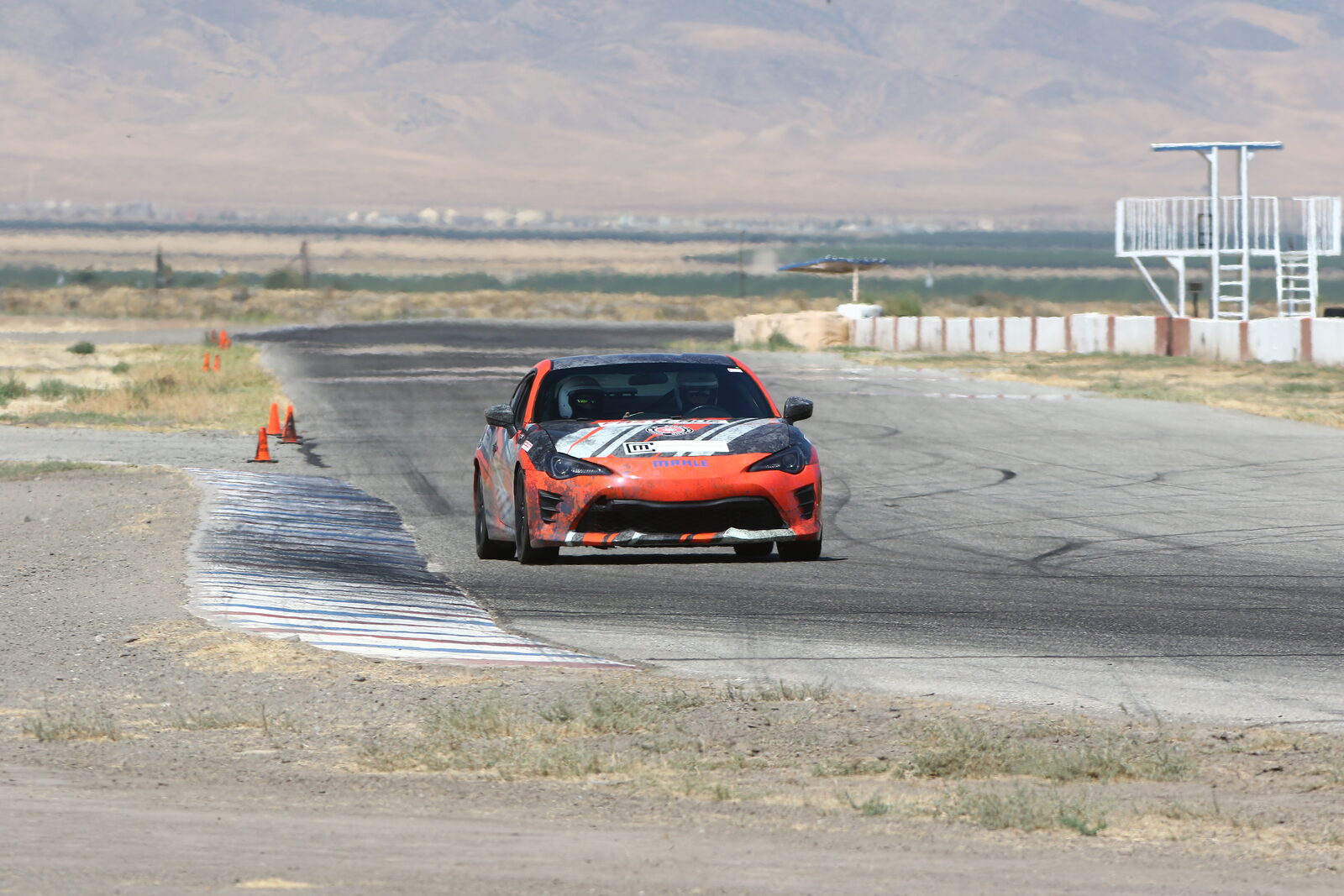 A FastLane car through the corners at Buttonwillow Raceway Park