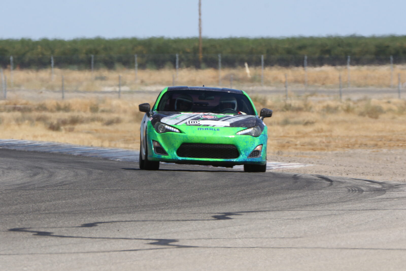 A FastLane car cornering at Buttonwillow Raceway Park