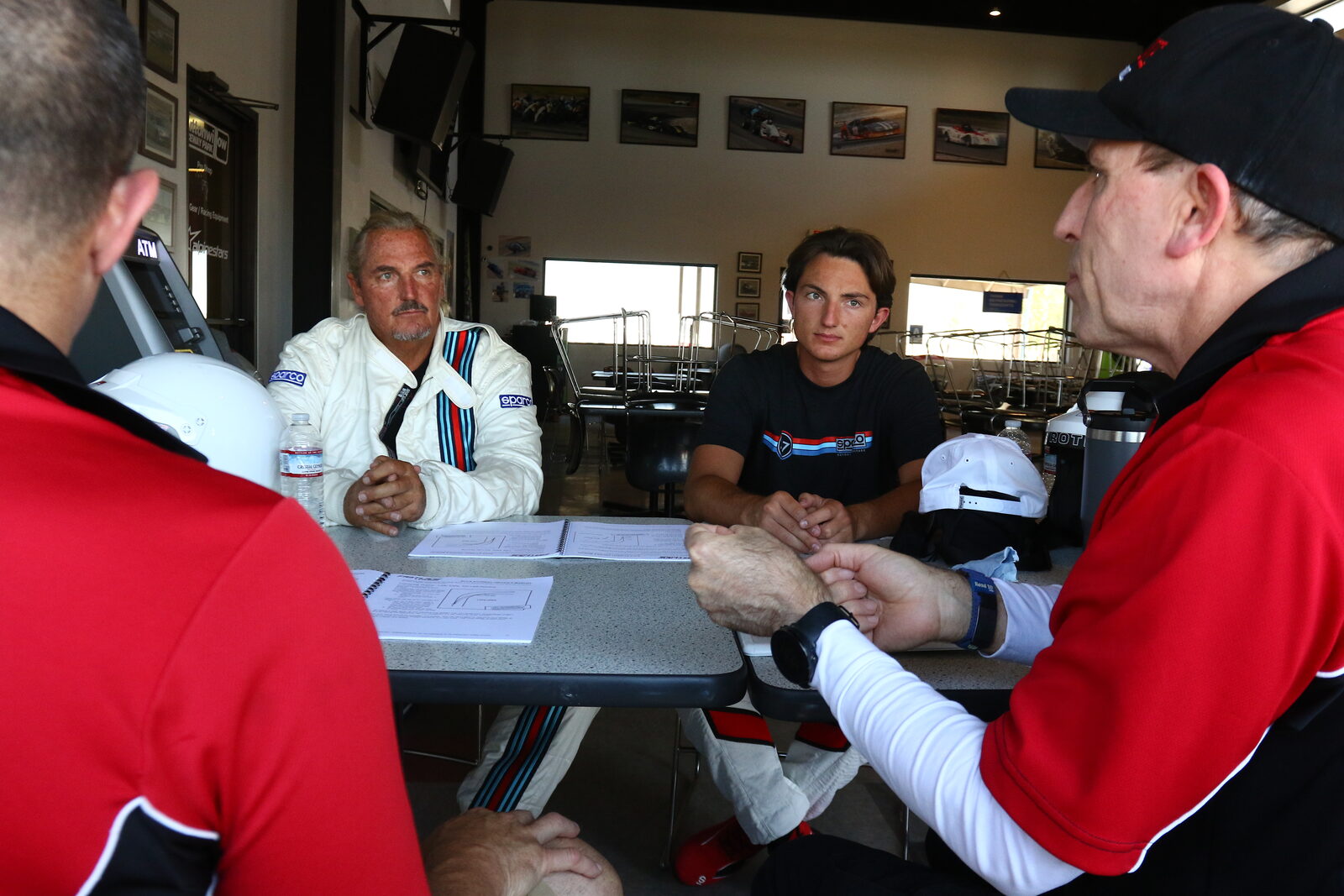FastLane Racing School instructors and a student in our garage at Buttonwillow