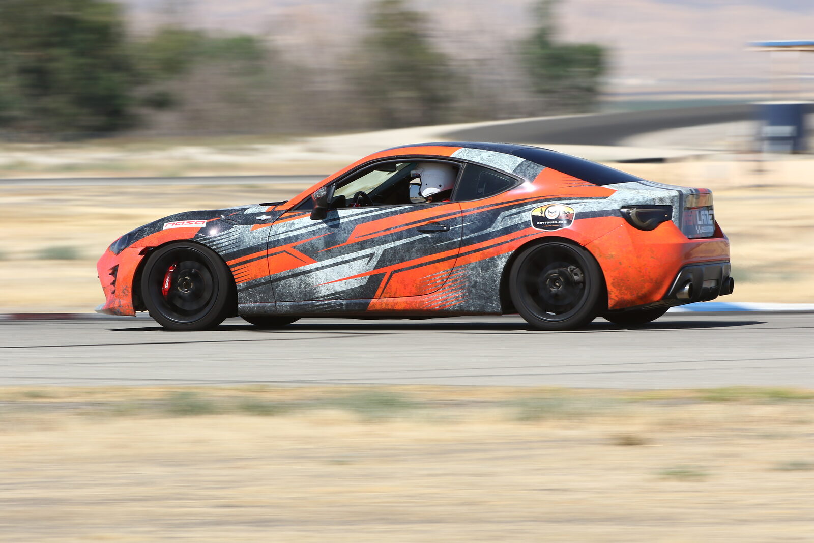 A FastLane Racing School car on track at Buttonwillow Raceway Park