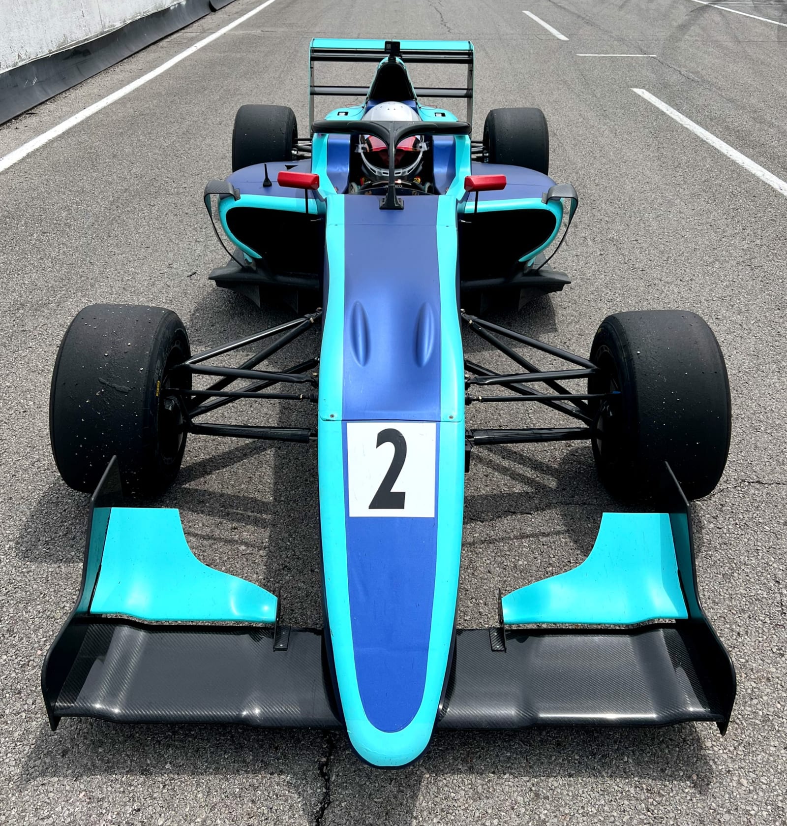The FastLane Ligier JS F4 open-wheel formula car at Buttonwillow Raceway Park.