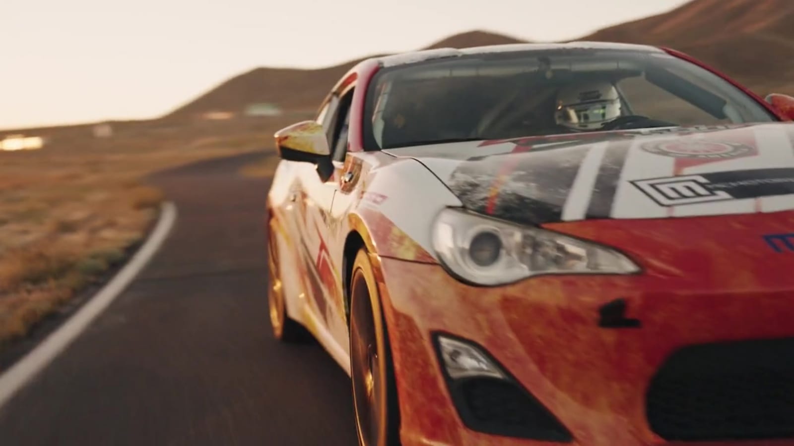 A RaceSchool.com race car at golden hour on the circuit at Buttonwillow Raceway Park.