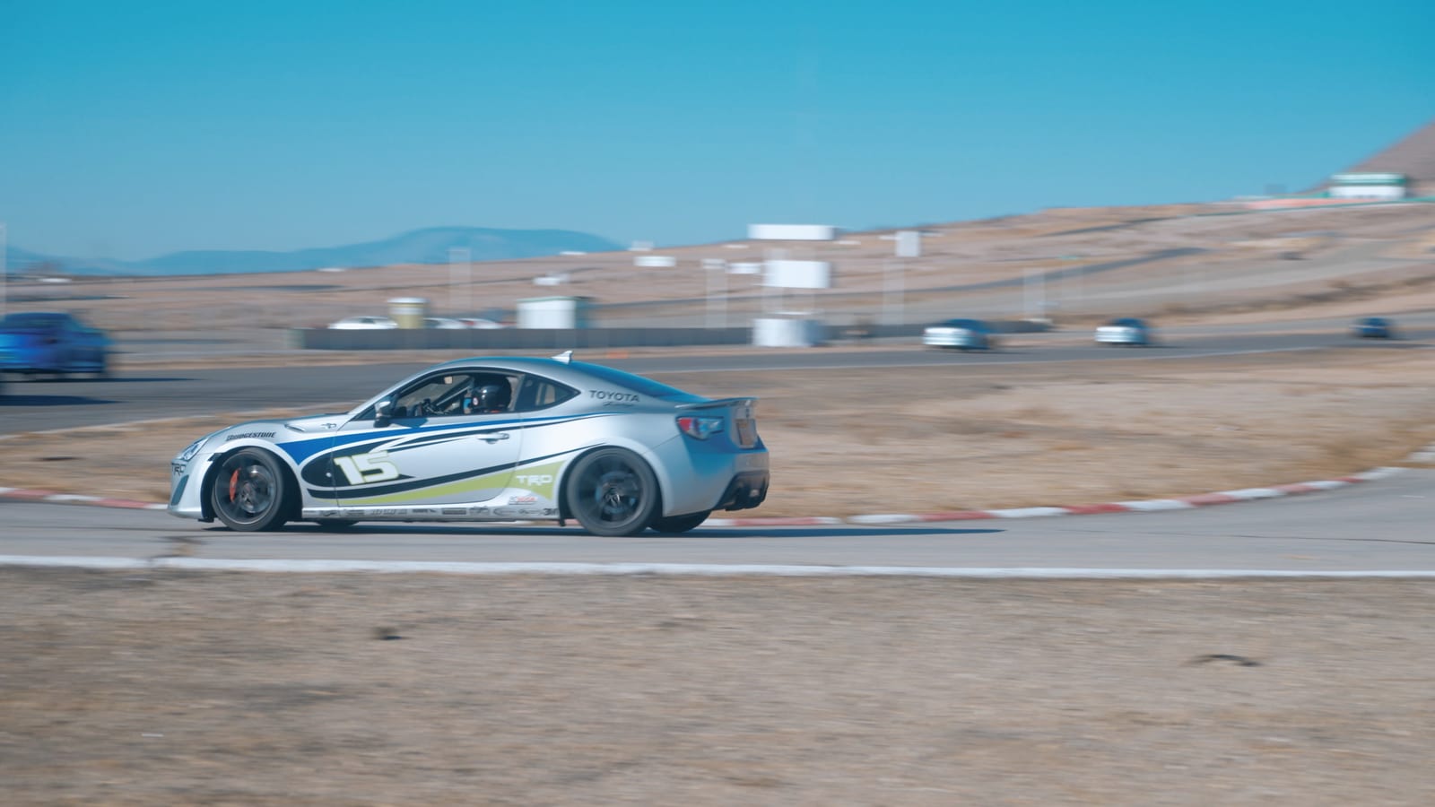 A dramatic studio-lit shot of a FastLane race car.