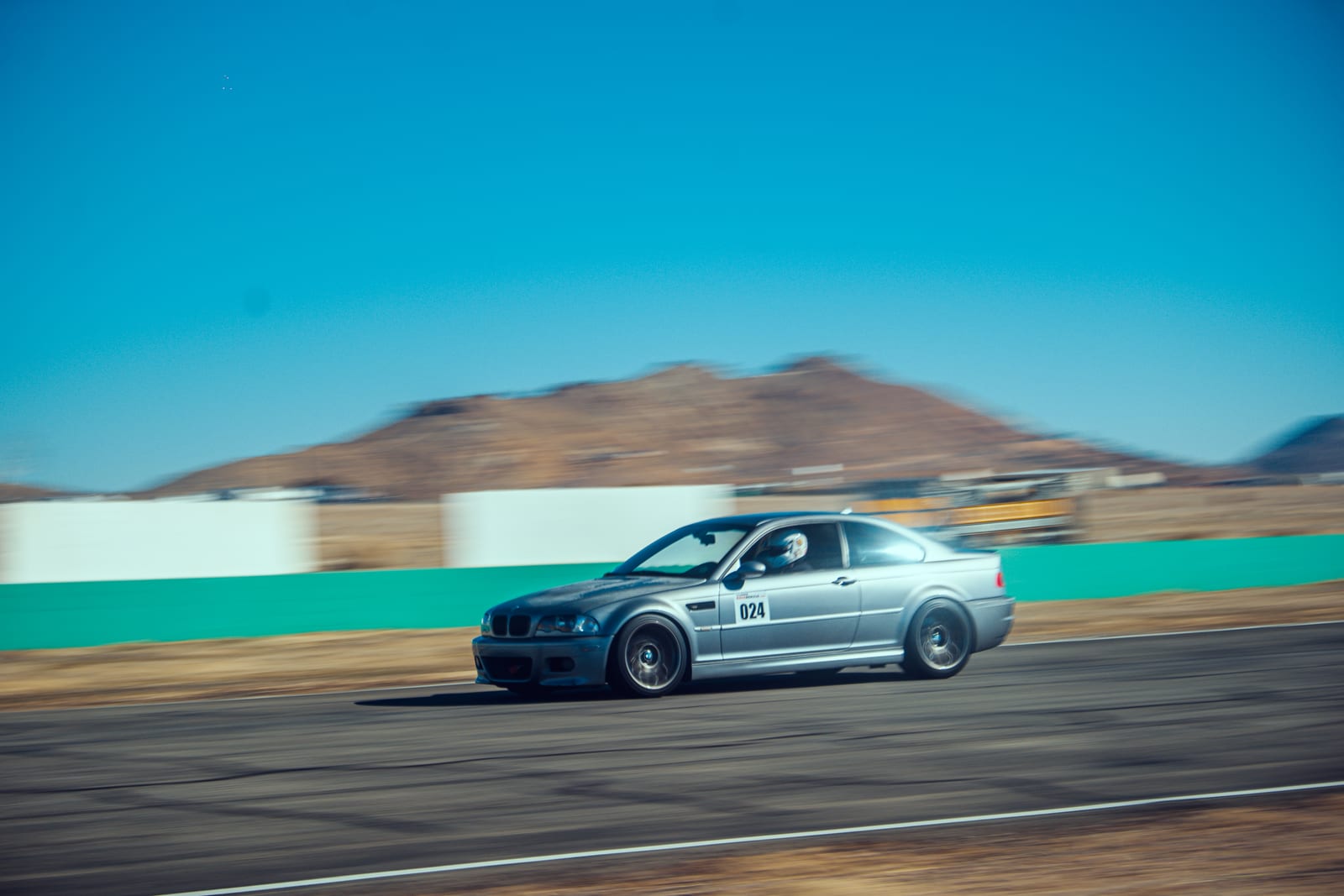 A liveried car on the circuit during a Buttonwillow track day.